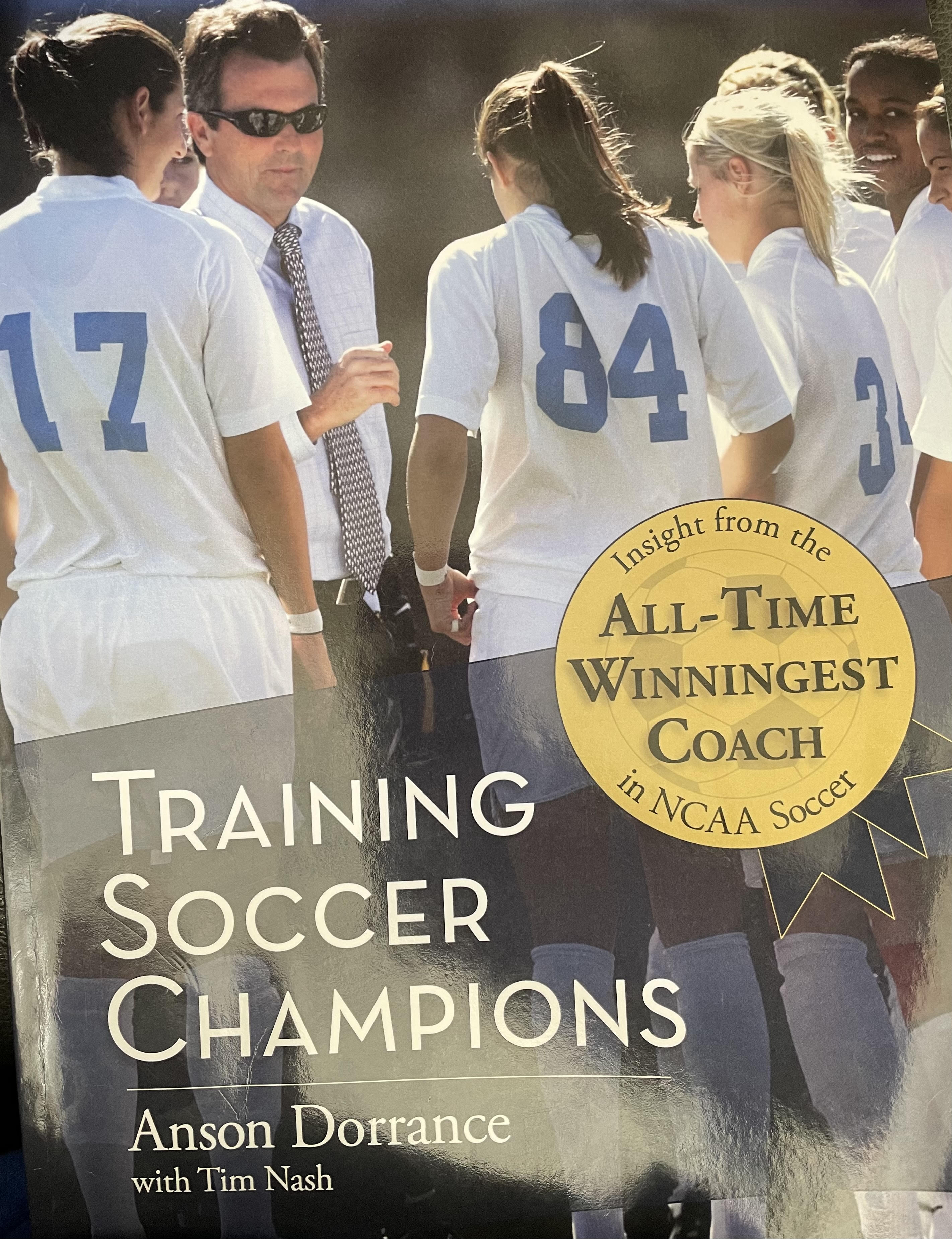 training soccer champions book cover with anson dorrance and team members